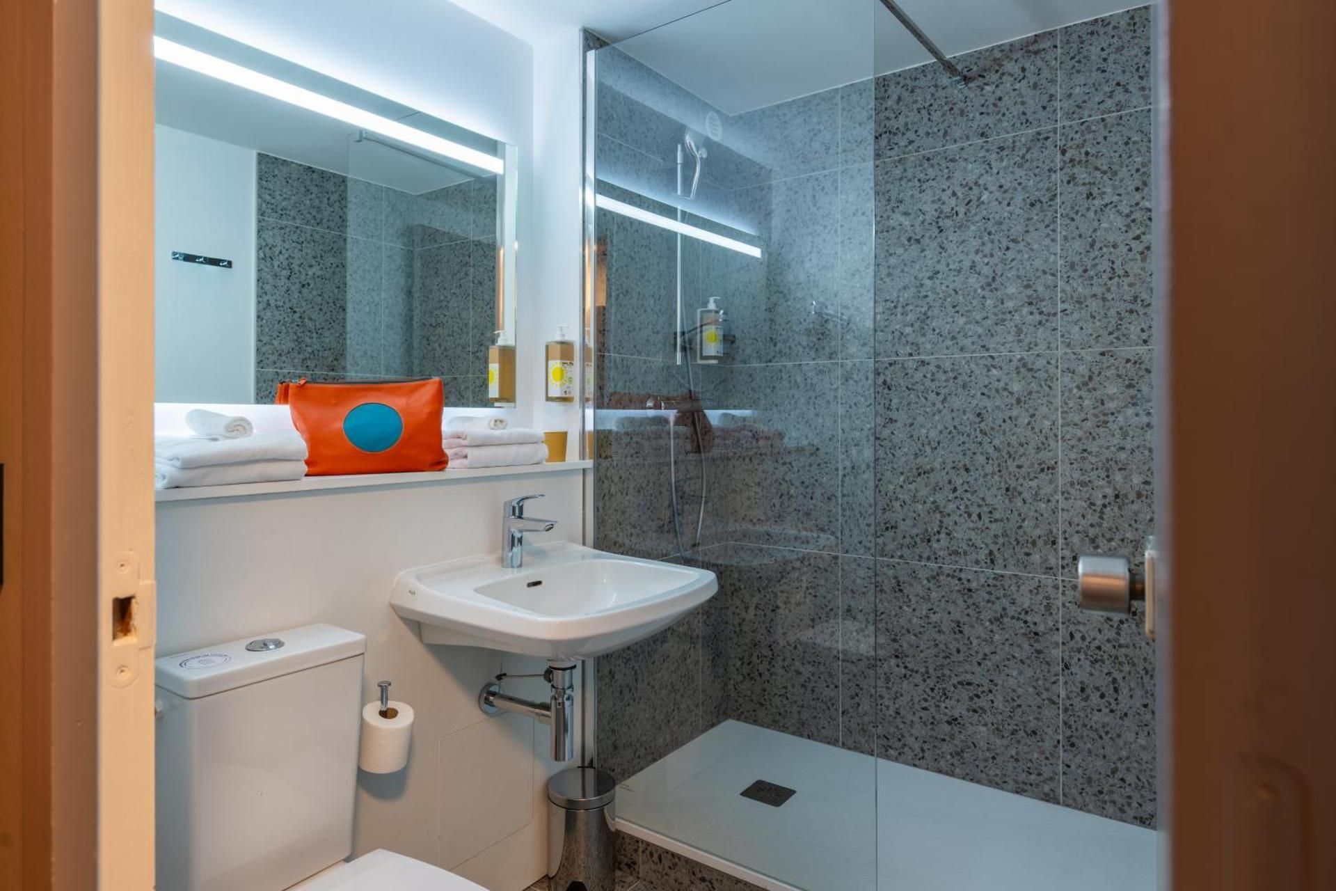 greet Hotel Chatellerault POP Triple Room 1 double bed and 1 sofa 3