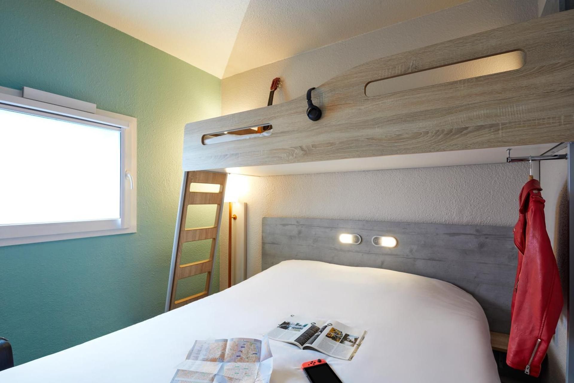 Triple - Room with a large bed and a bunk bed.