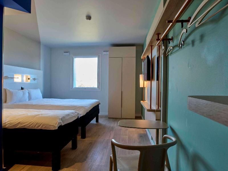 Family Room For 4 People With A Large Bed And 2 Single Beds