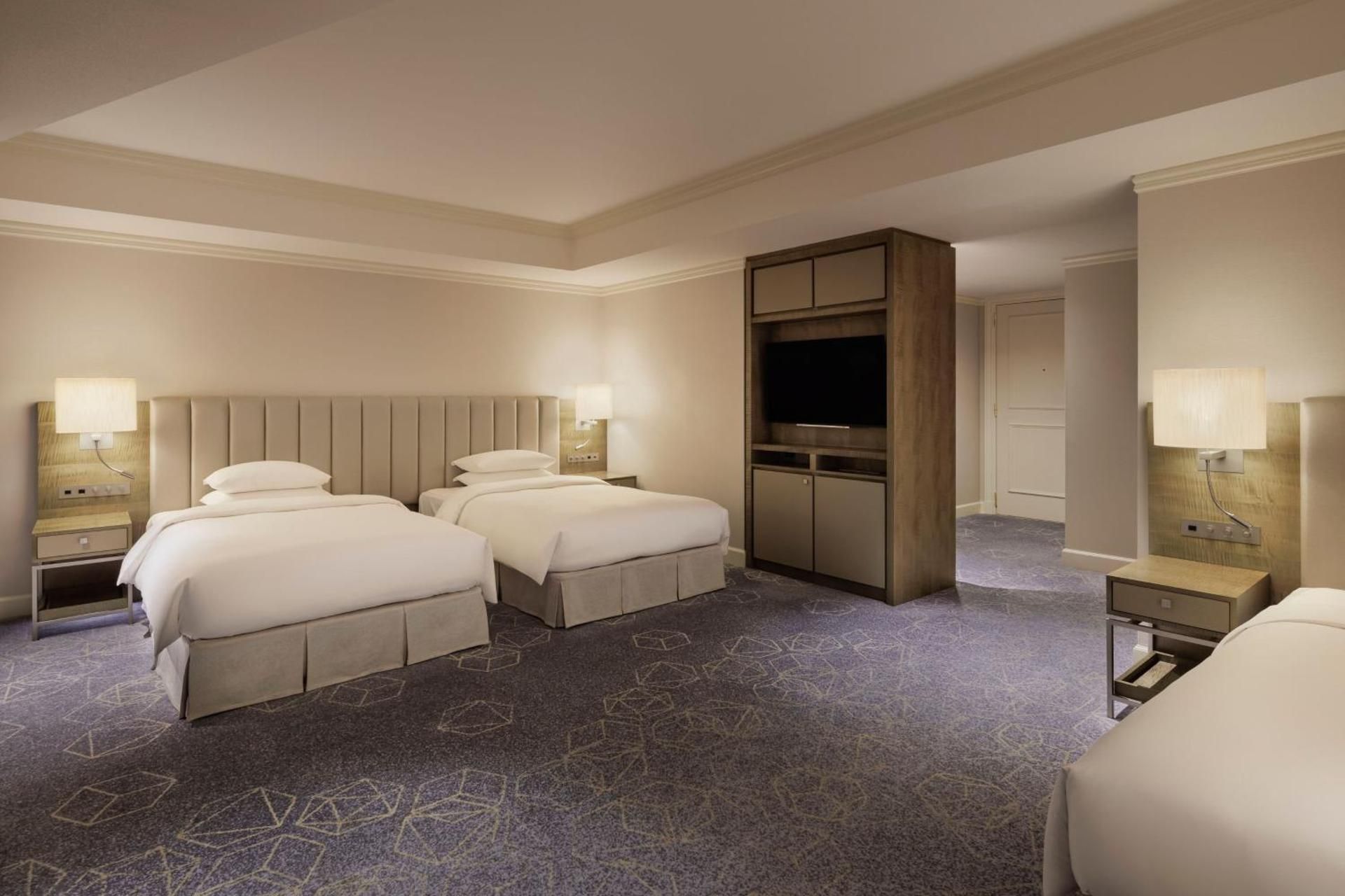Family Room with Three Twin Beds and Partial City View