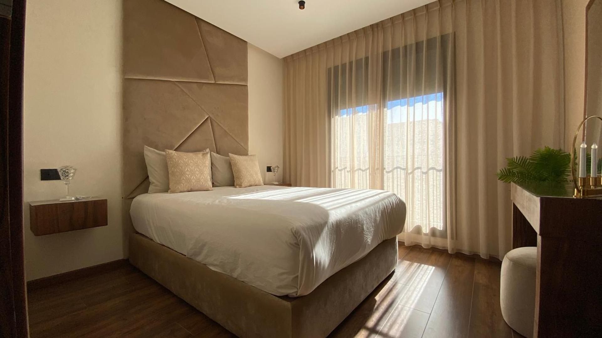 One-Bedroom Apartment with Balcony and City View