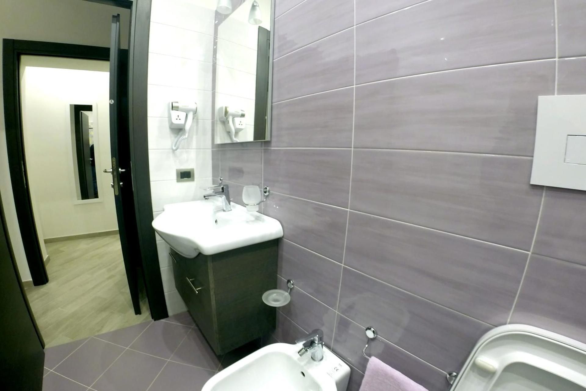 Deluxe Quadruple Room with Private Bathroom