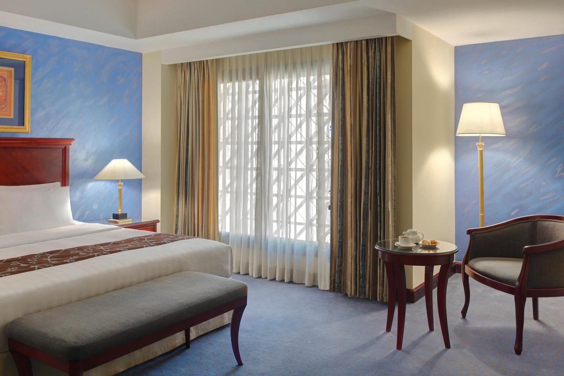 1 King 2 Single Corner Suite Up to 5 Guests