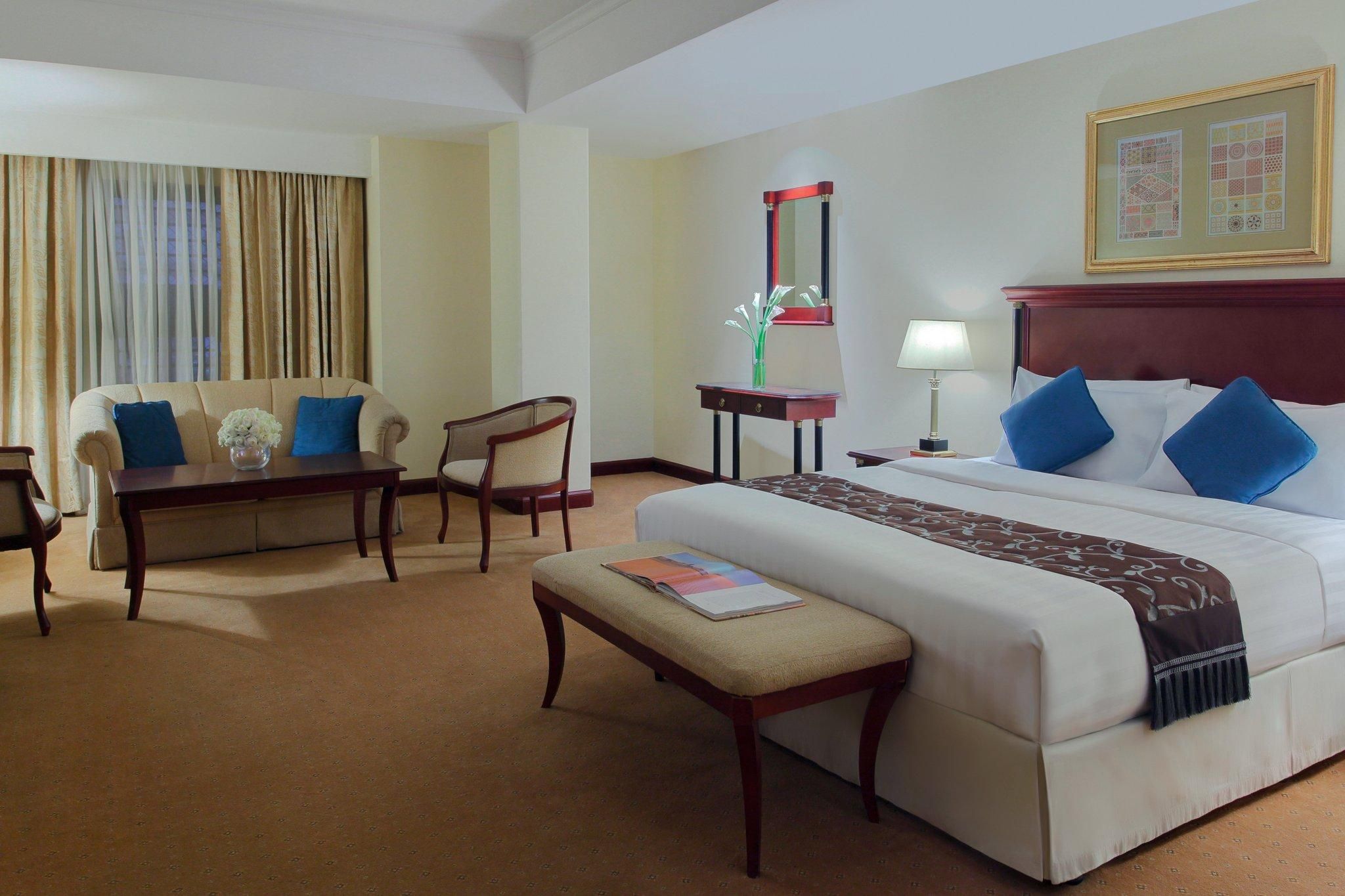 1 King 2 Single Corner Suite Up to 5 Guests