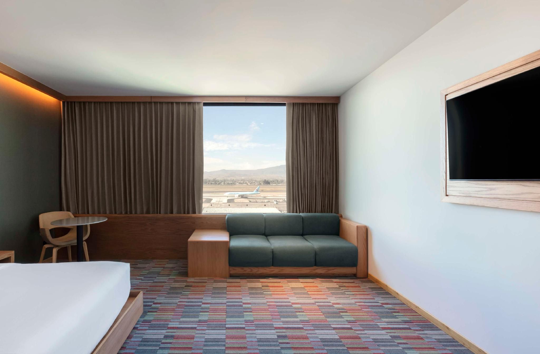 I King Bed Junior Suite with Airport View