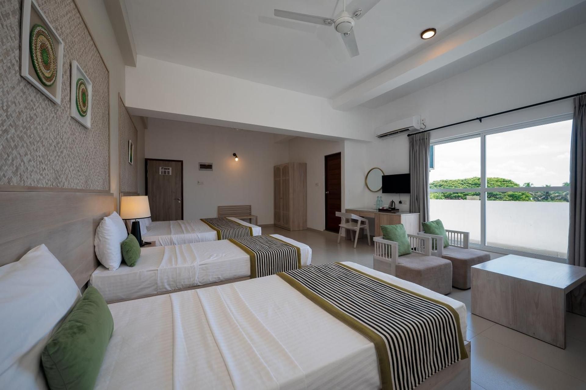 Hotel Oviya Family Suite with Balcony 2