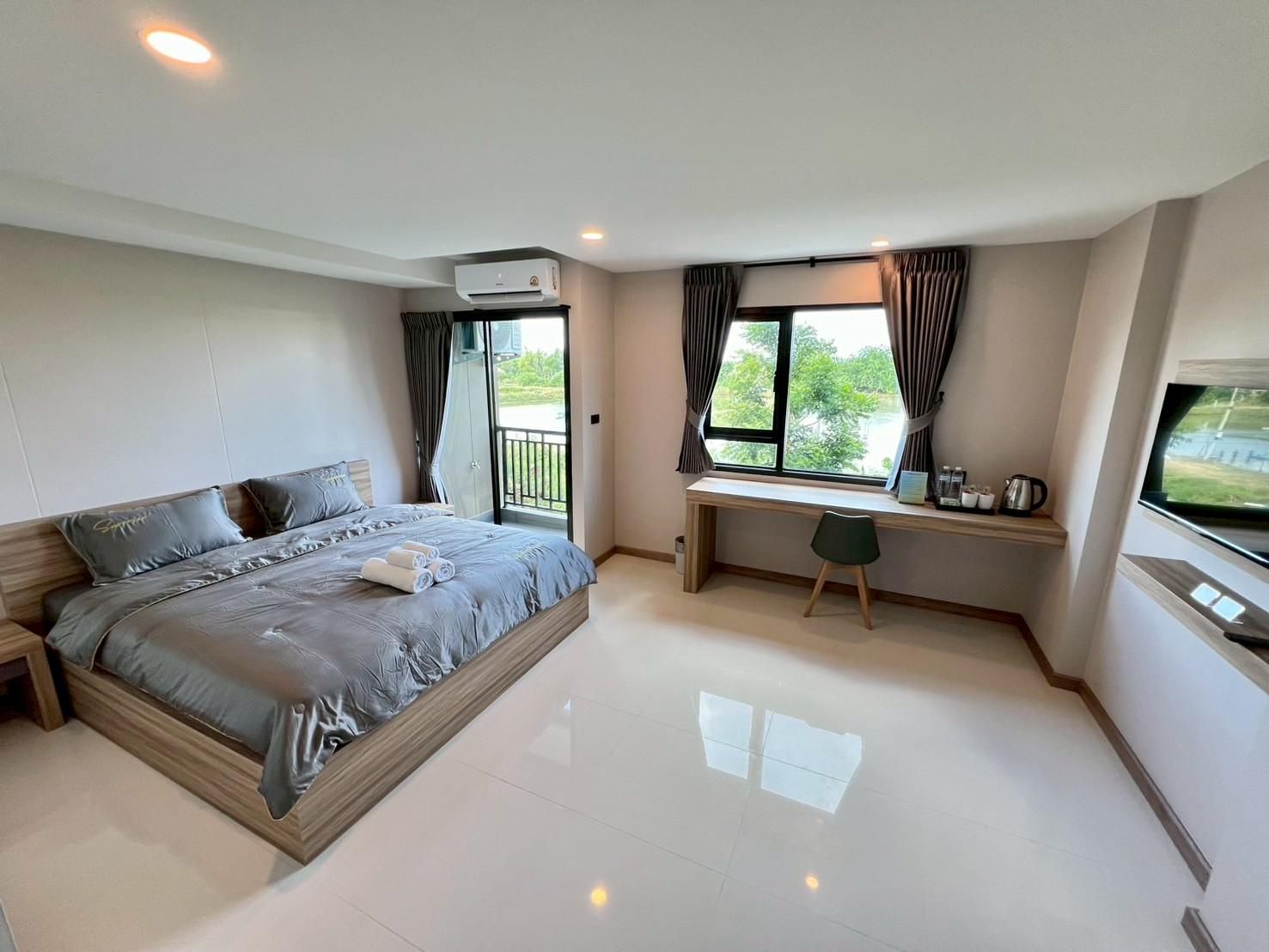 Wellgrow Service House - เวลโกรว์ เซอร์วิส เฮ้าส์ Deluxe - 1 Bedroom Apartment Garden view 2