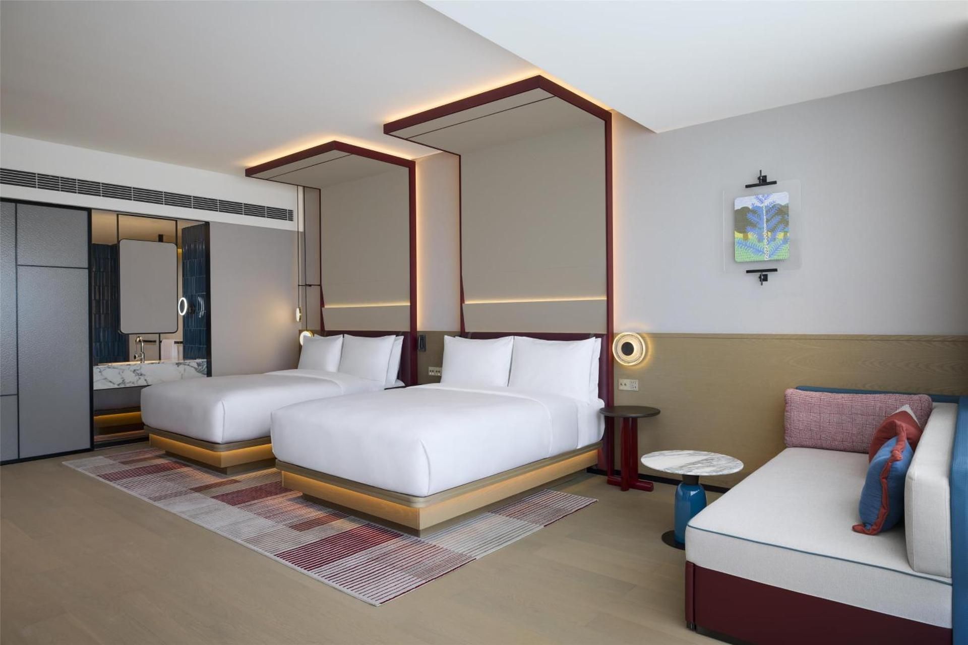 Deluxe Room with Two Queen Beds and Sofa Bed