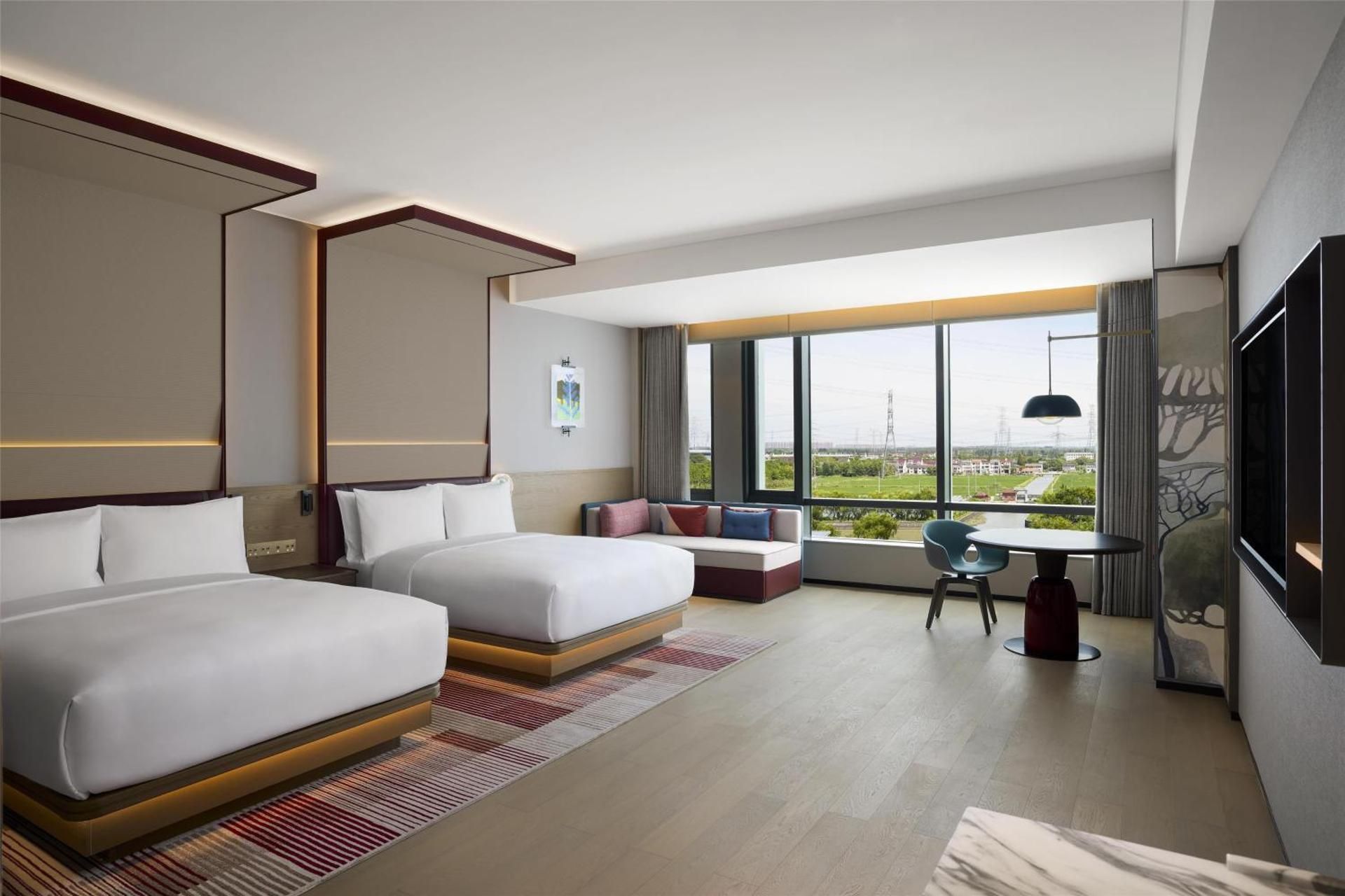 Deluxe Room with Two Queen Beds and Sofa Bed