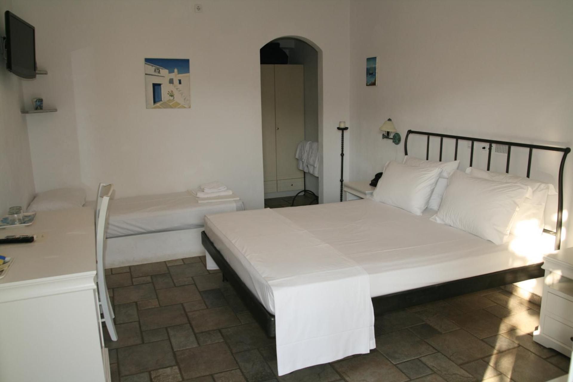 Triple Room with Partial Sea View (2 Adults + 1 Child)