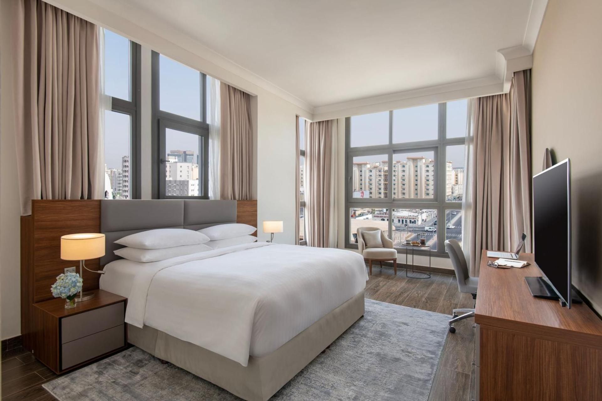 Three-Bedroom Duplex Apartment with Balcony and City View