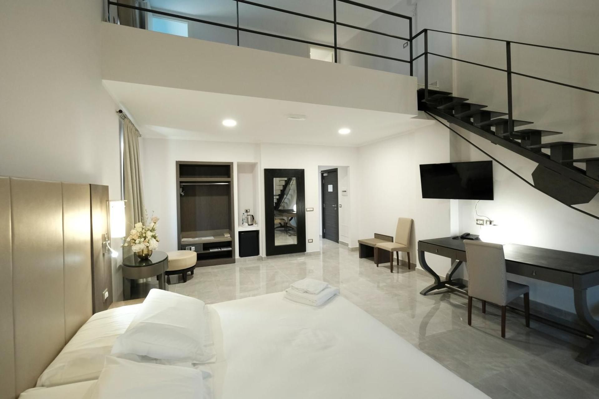 Family Room with One King Bed and Three Single Beds - Non-Smoking