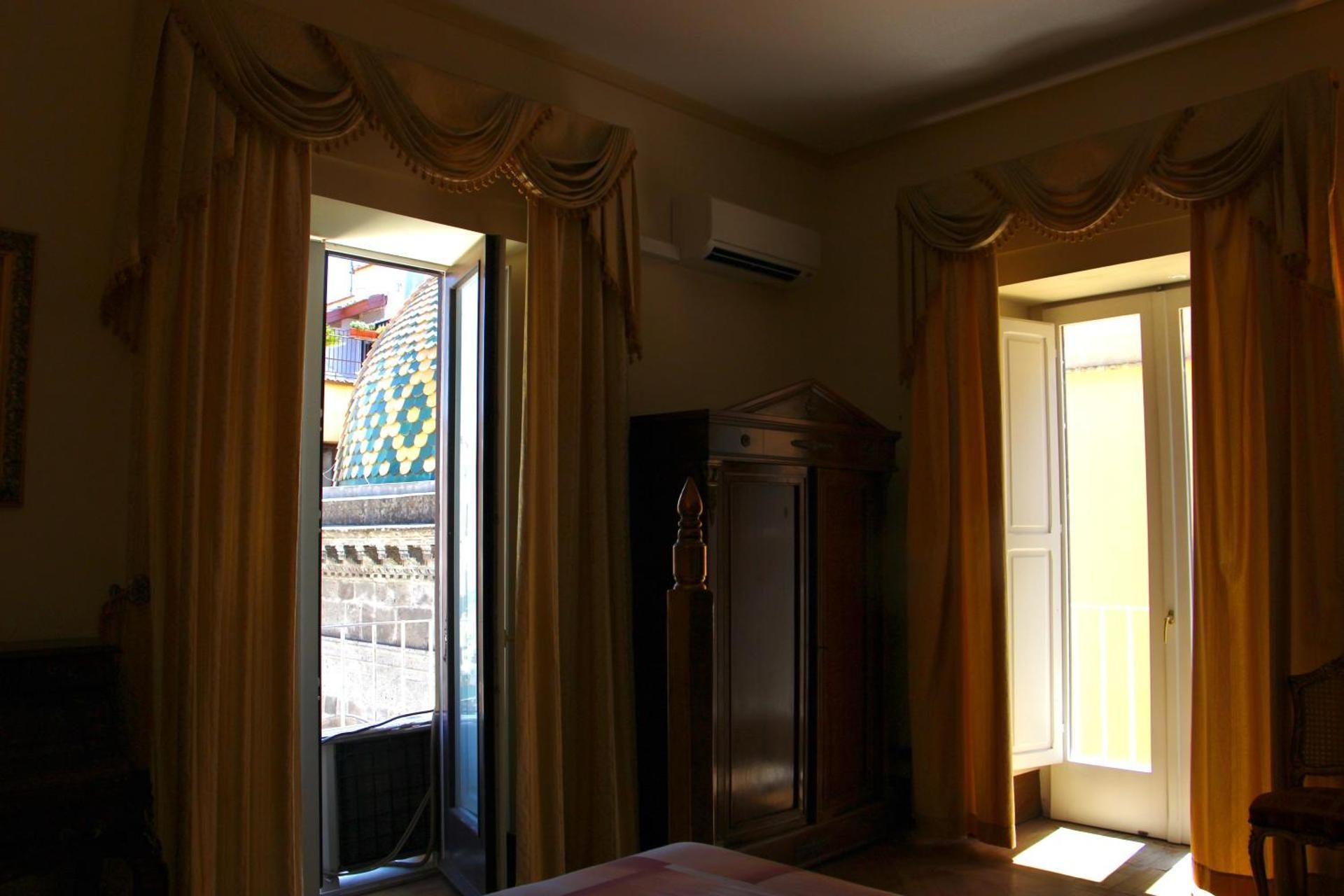 One-Bedroom Apartment with Balcony and City View