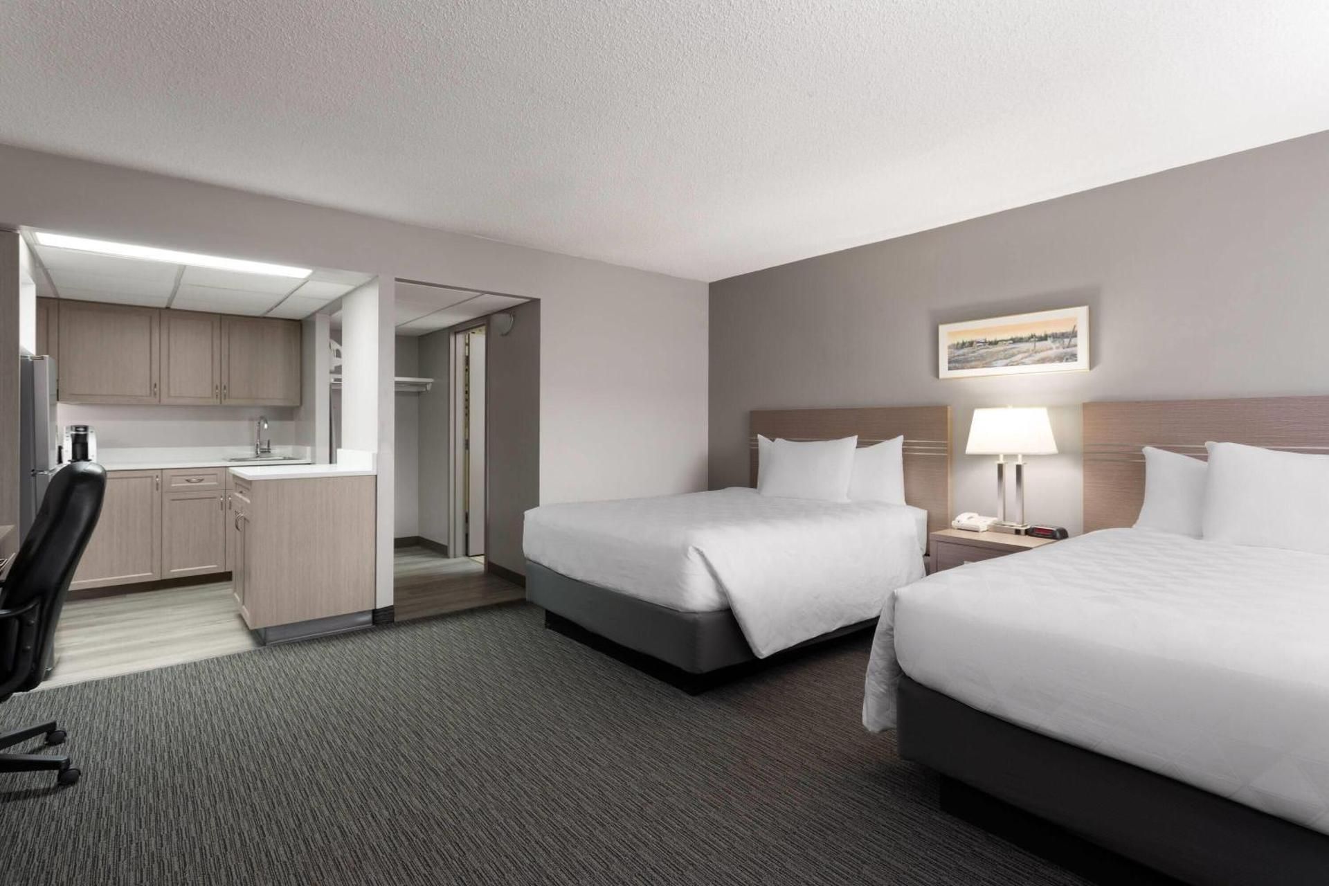 Travelodge by Wyndham Grande Prairie 2 Queen Beds, Deluxe Room, Full Kitchen, Ground Floor, Smoking