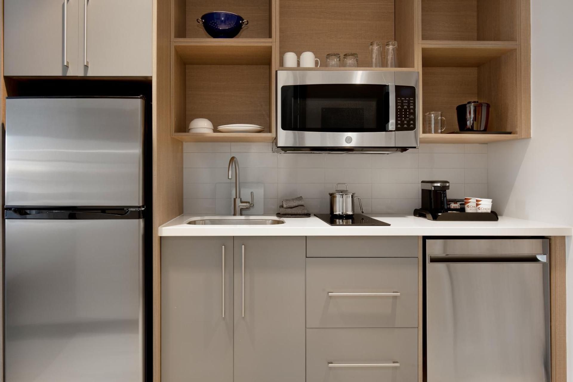 Efficiency Quadruple Room with Two Queen Beds - Non Smoking