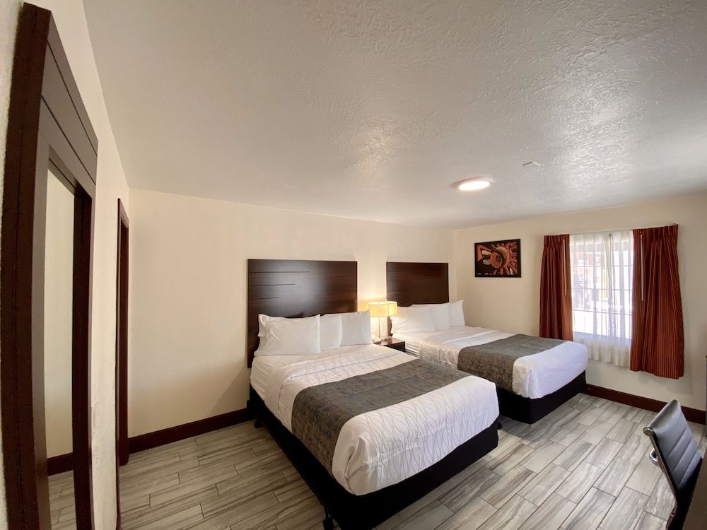 Roswell Inn Standard 2 Queen Pillow top Beds