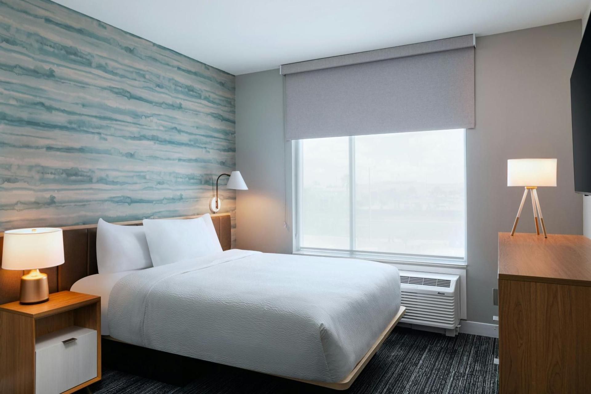 One-Bedroom King Suite with Sofa Bed - Mobility and Hearing Accessible with Roll-in Shower