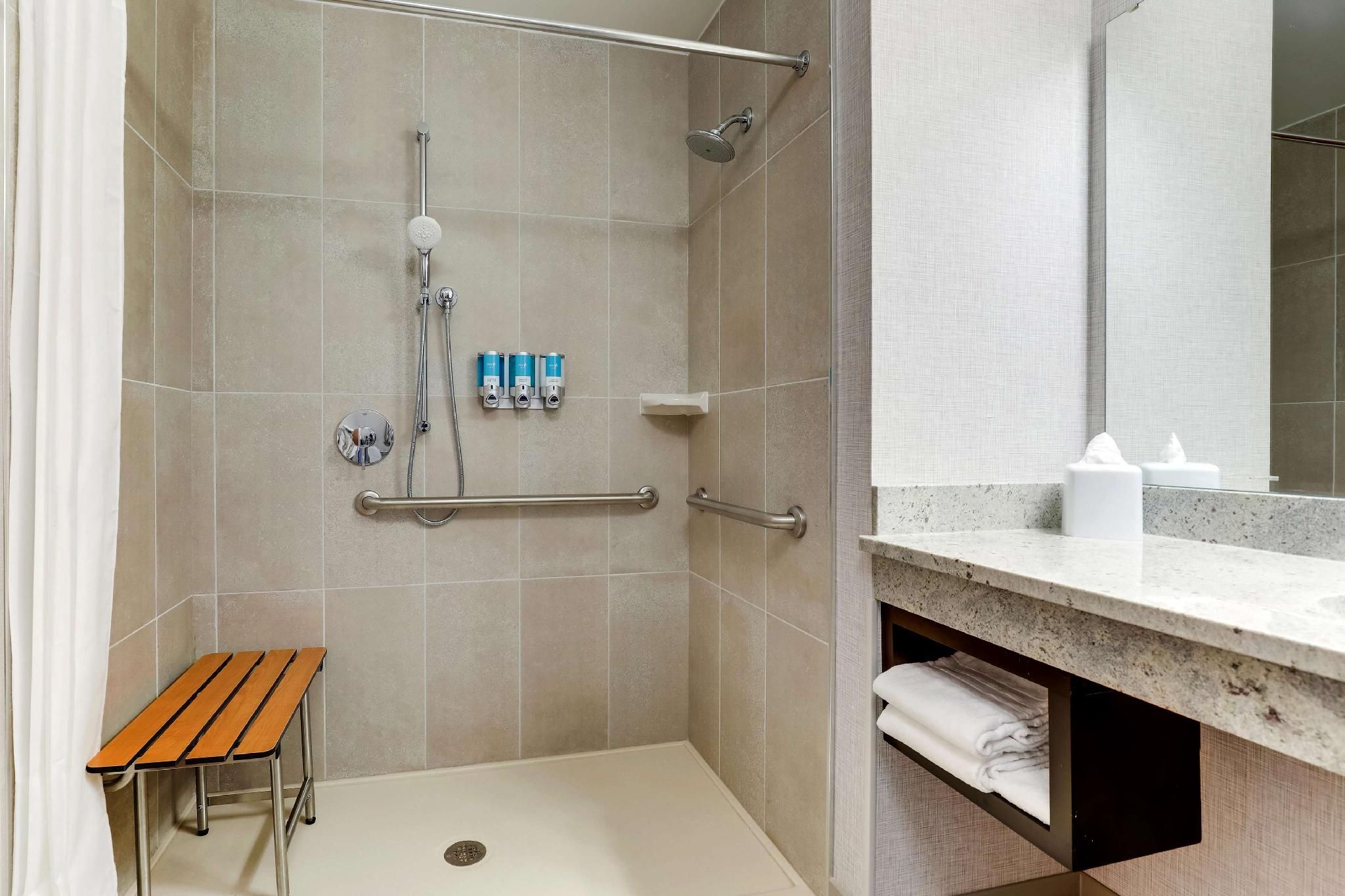 Queen Suite with Sofa Bed - Hearing Accessible, Roll-in Shower