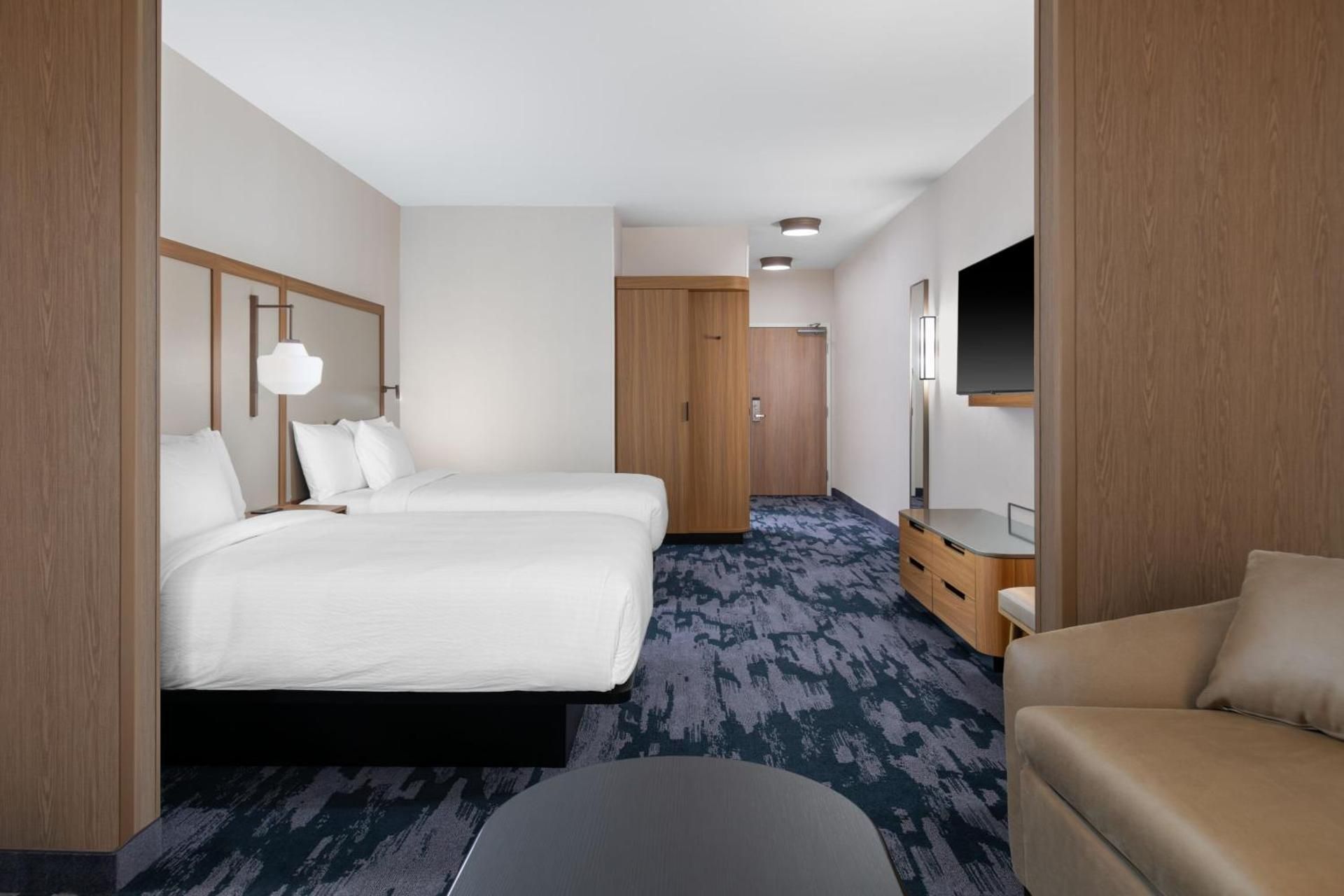 Extended Queen Suite with Two Queen and Sofa Bed