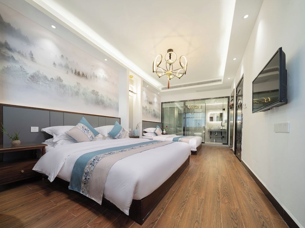 Qixin Xianting Hotel Standard Quadruple Room 3