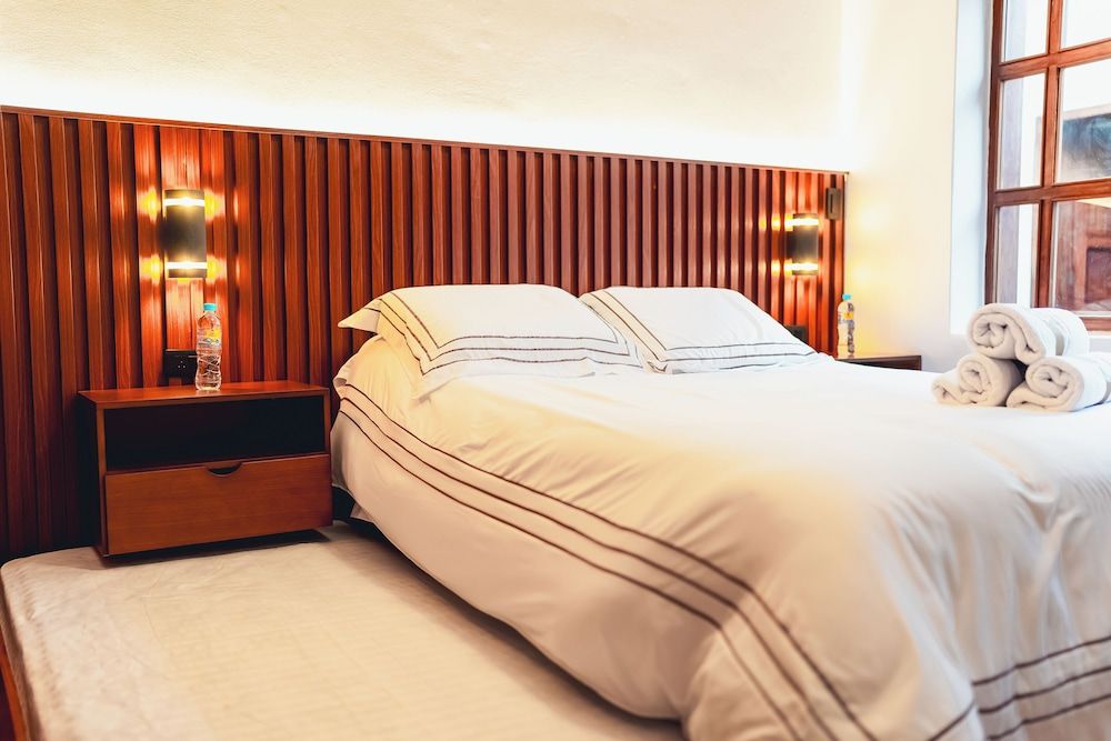 Deluxe Room, Multiple Beds, Private Bathroom, Courtyard View