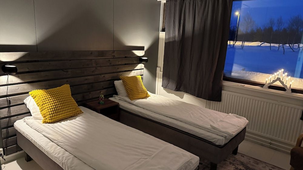 Arctic Raja Inn Basic Triple Room, Courtyard View