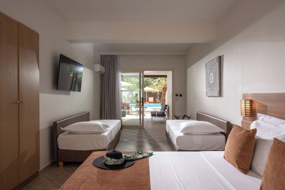 Comfort Quadruple Room, Patio, Pool View