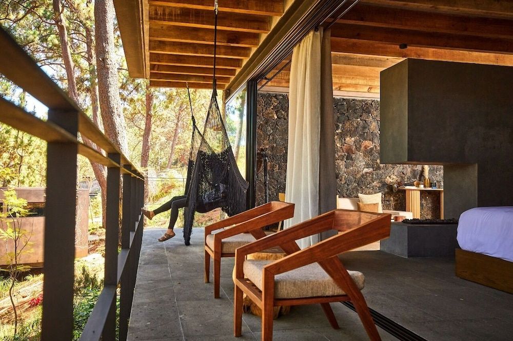 Fishers House Hotel Avándaro Hammock Suite with king bed and fireplace 3