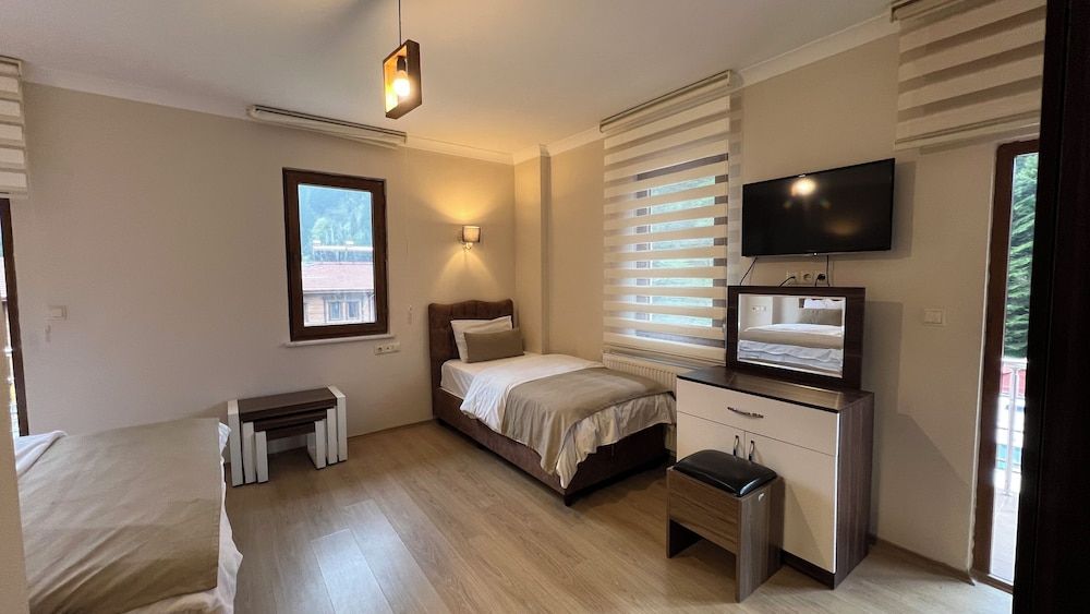 Deluxe Triple Room, Balcony, Garden View