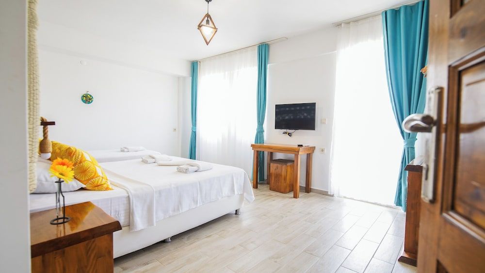 Deluxe Triple Room, Balcony, Garden View
