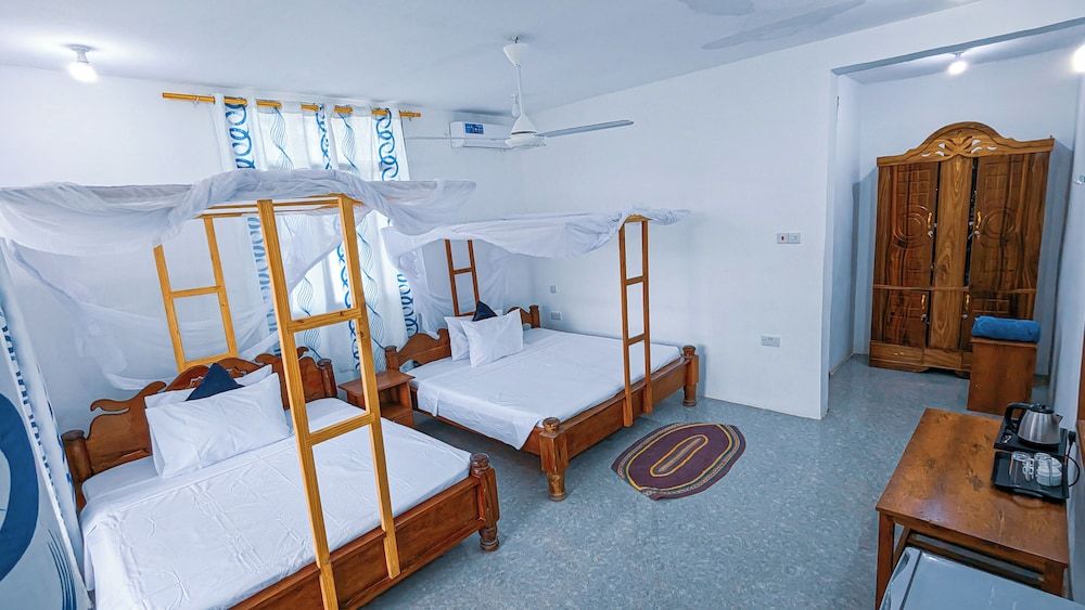 Deluxe Quadruple Room, Balcony, Garden View