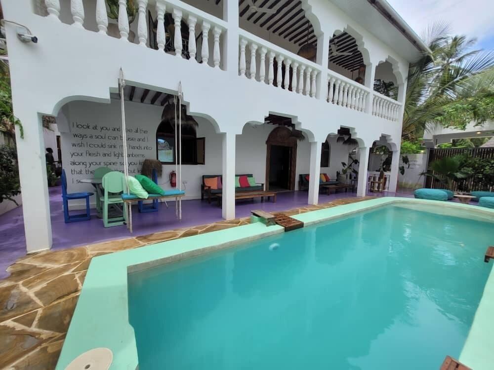 Sand and Sunset JGM Hotel Paje Deluxe Twin Room, Pool View 10