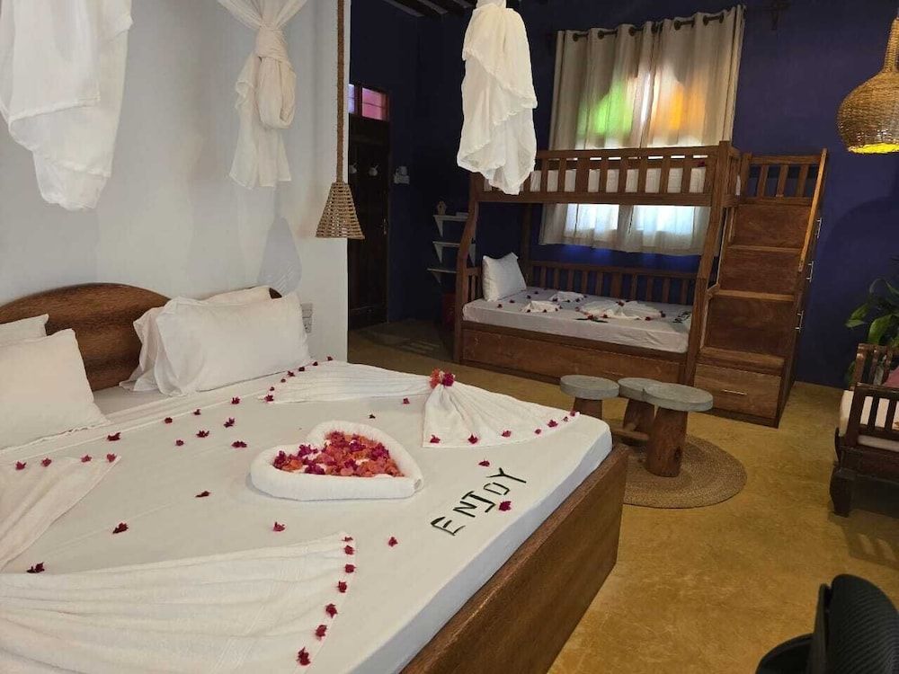 Sand and Sunset JGM Hotel Paje Deluxe Triple Room 3