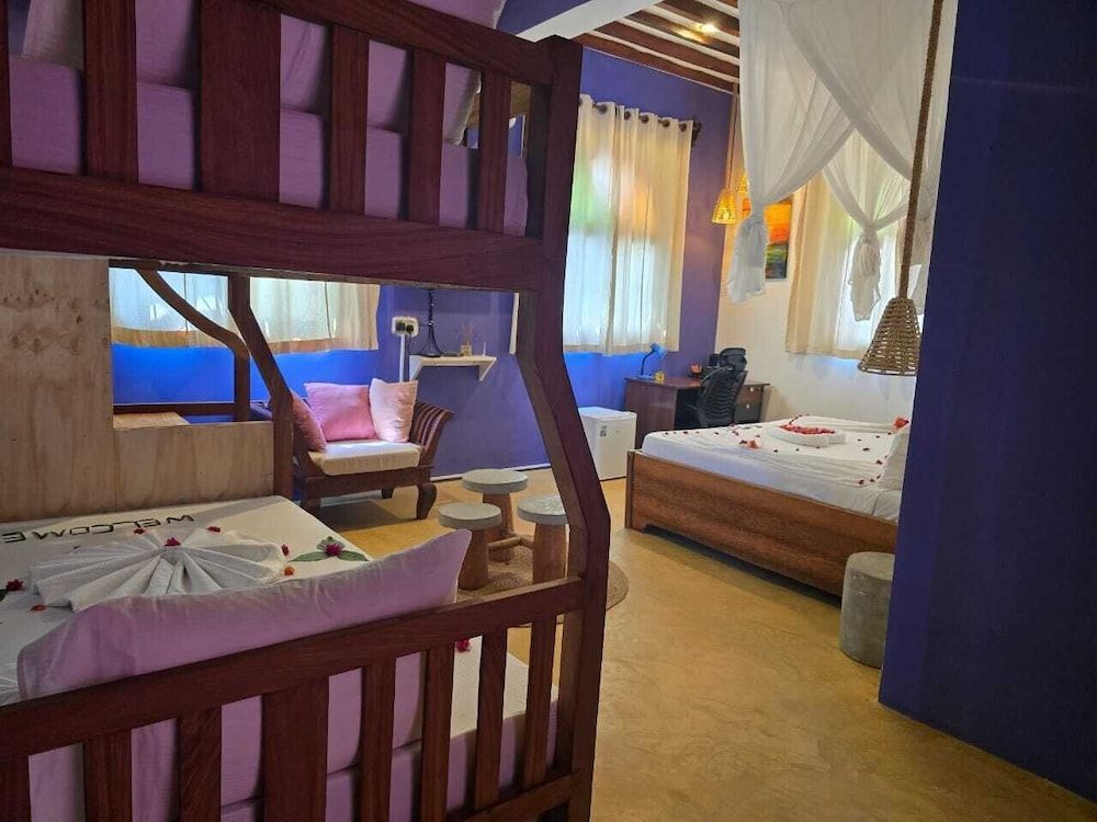 Sand and Sunset JGM Hotel Paje Deluxe Triple Room 4