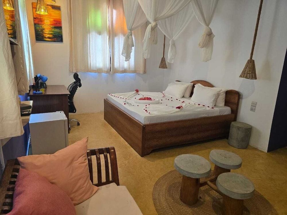 Sand and Sunset JGM Hotel Paje Deluxe Triple Room 7