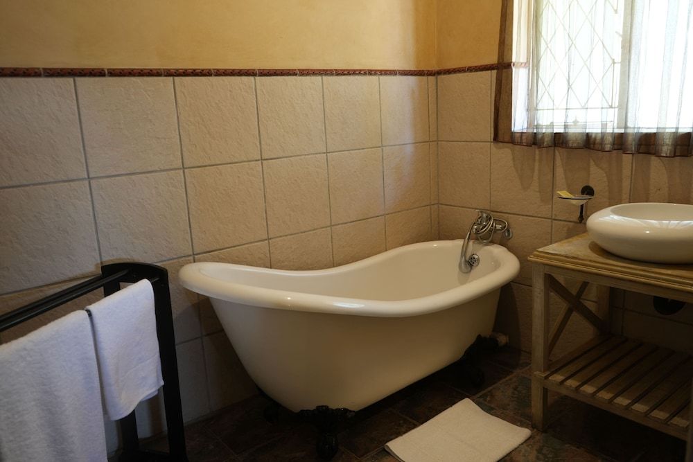 Tuscan Lodge Polokwane Deluxe Suite, Patio, Garden View 11