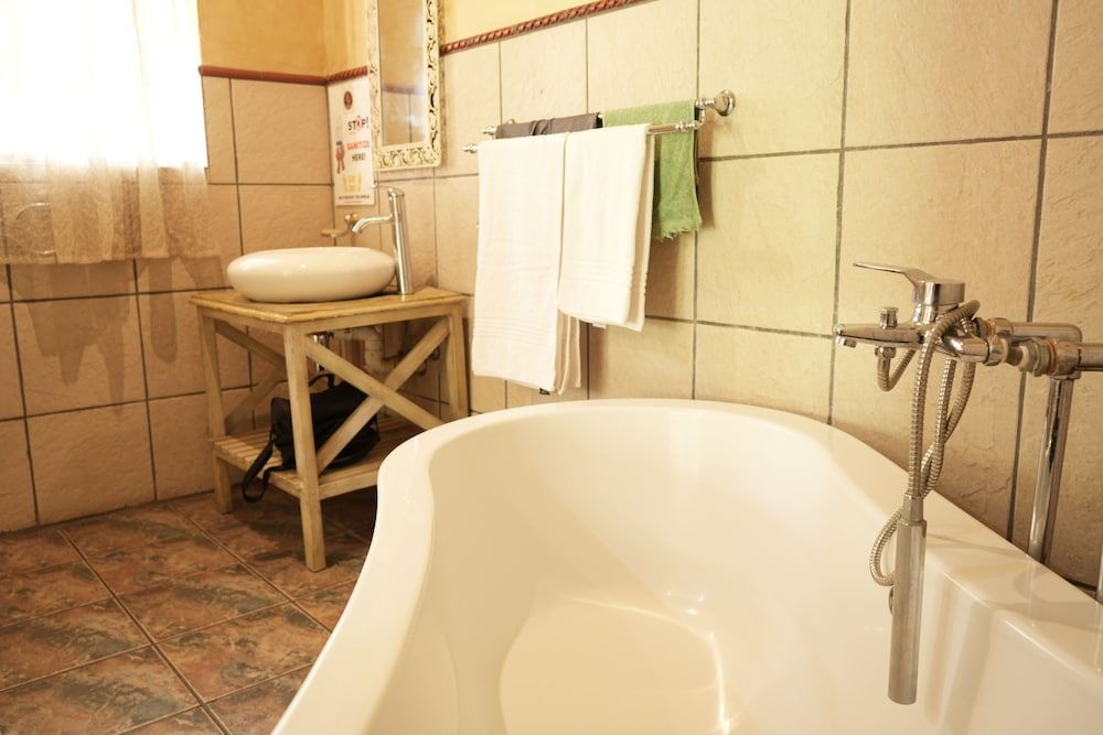 Tuscan Lodge Polokwane Deluxe Suite, Patio, Garden View 12