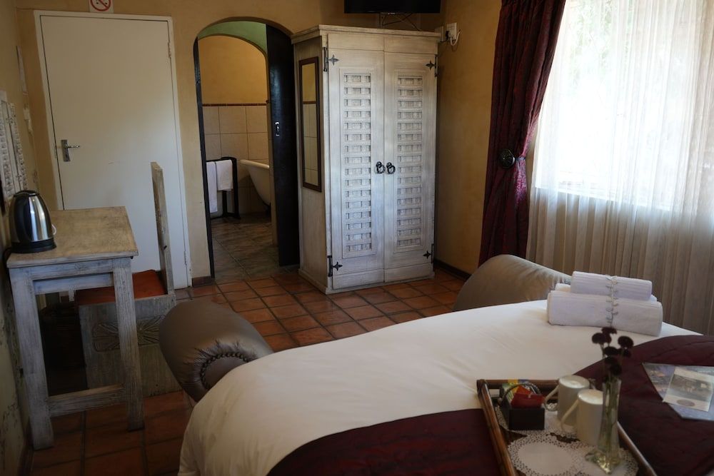 Tuscan Lodge Polokwane Deluxe Suite, Patio, Garden View 7