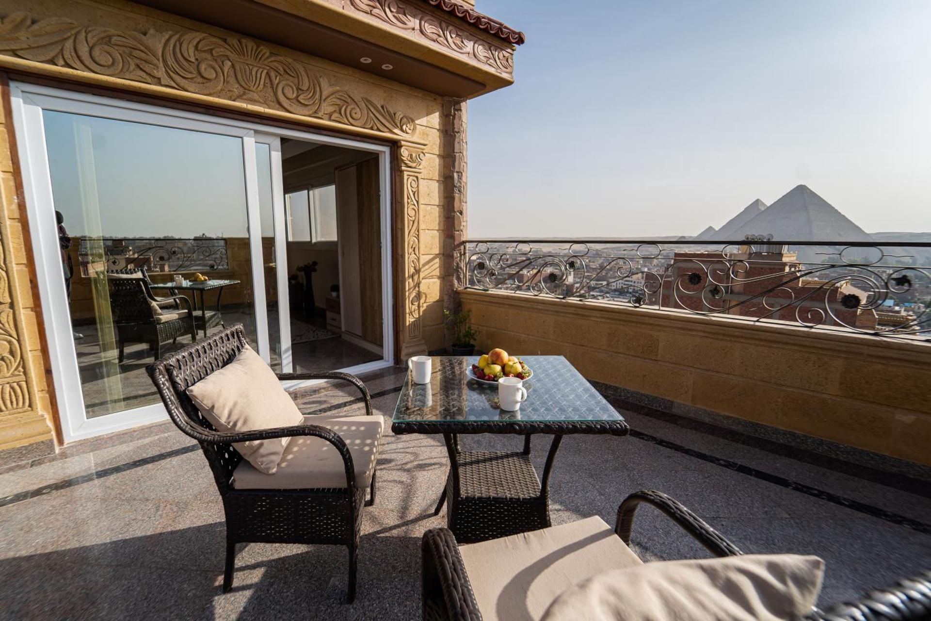 Family Room with Balcony and Pyramids View