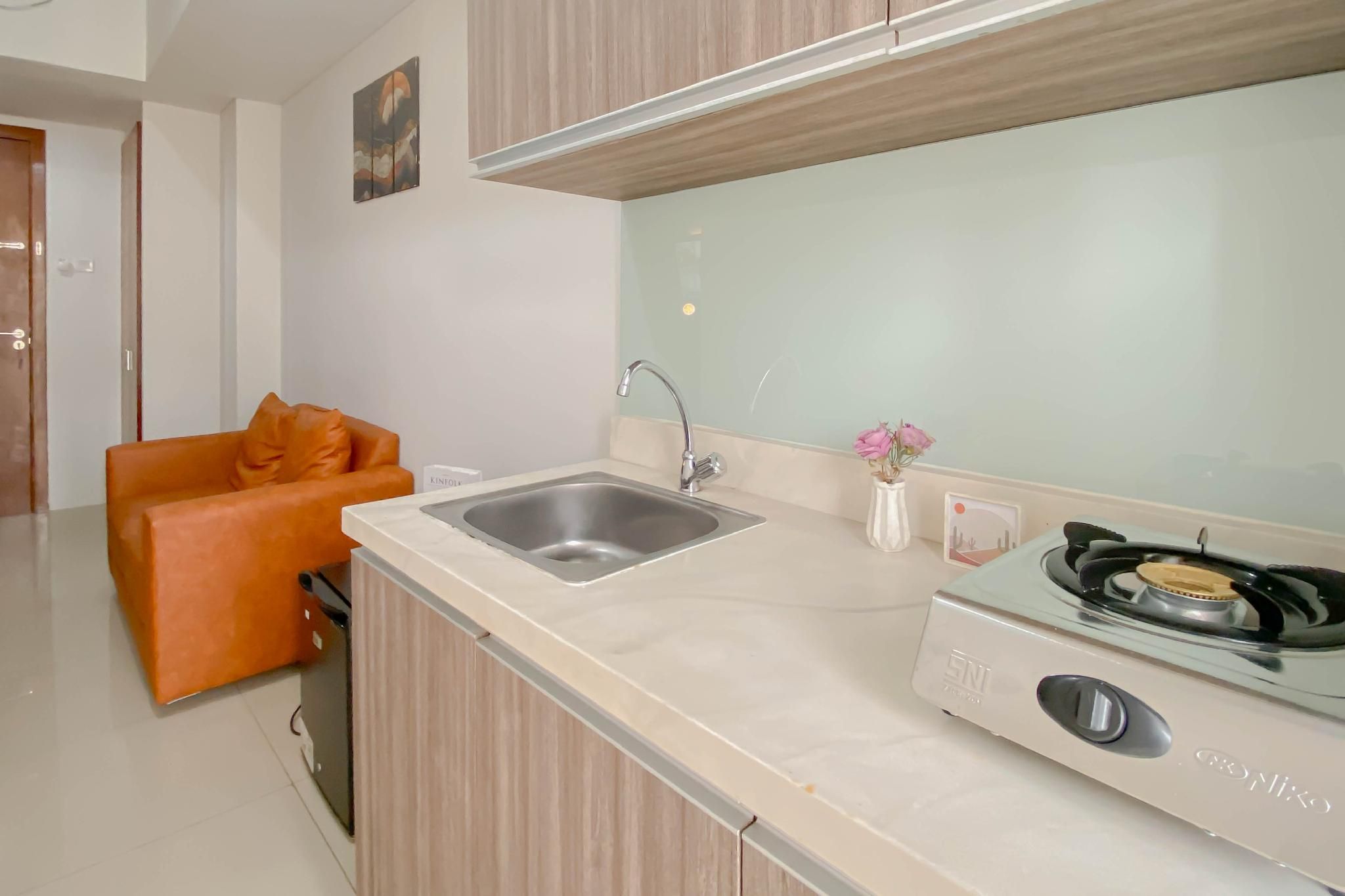 Minimalist 1BR Apt Vittoria Residence By Travelio
