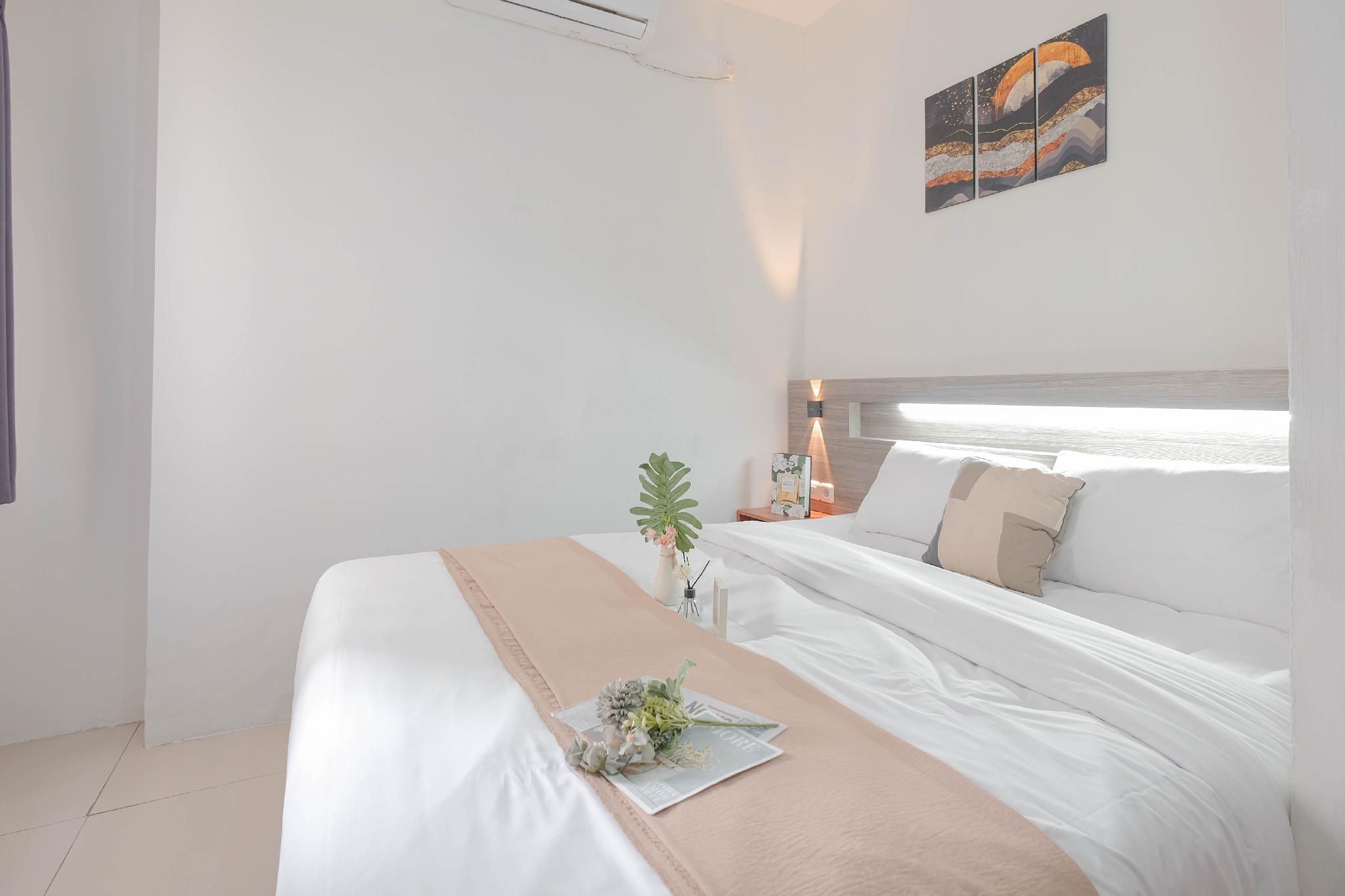 Minimalist 2BR Apt Vittoria Residence By Travelio