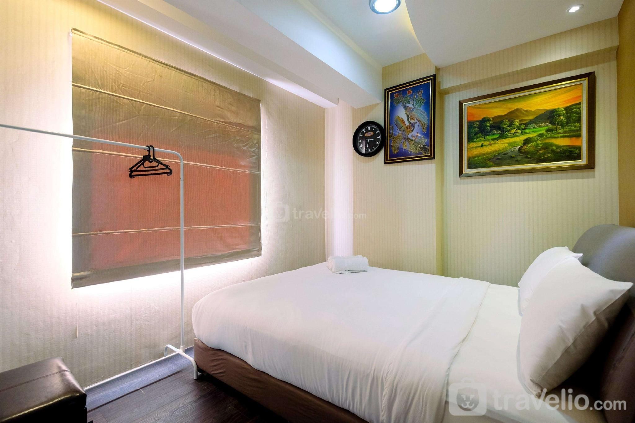 Homey 2BR at Green Bay Pluit Apartment By Travelio