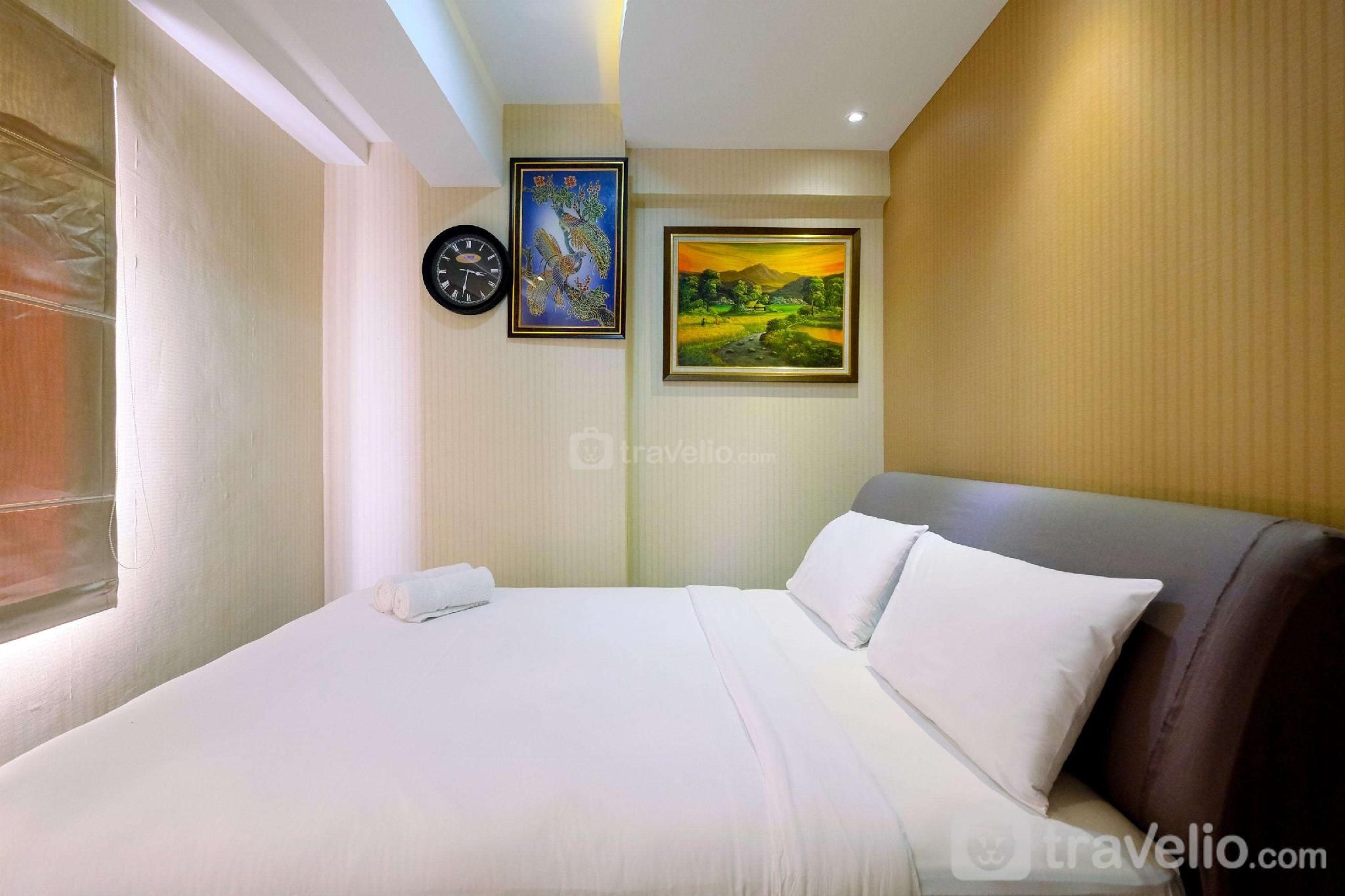 Homey 2BR at Green Bay Pluit Apartment By Travelio