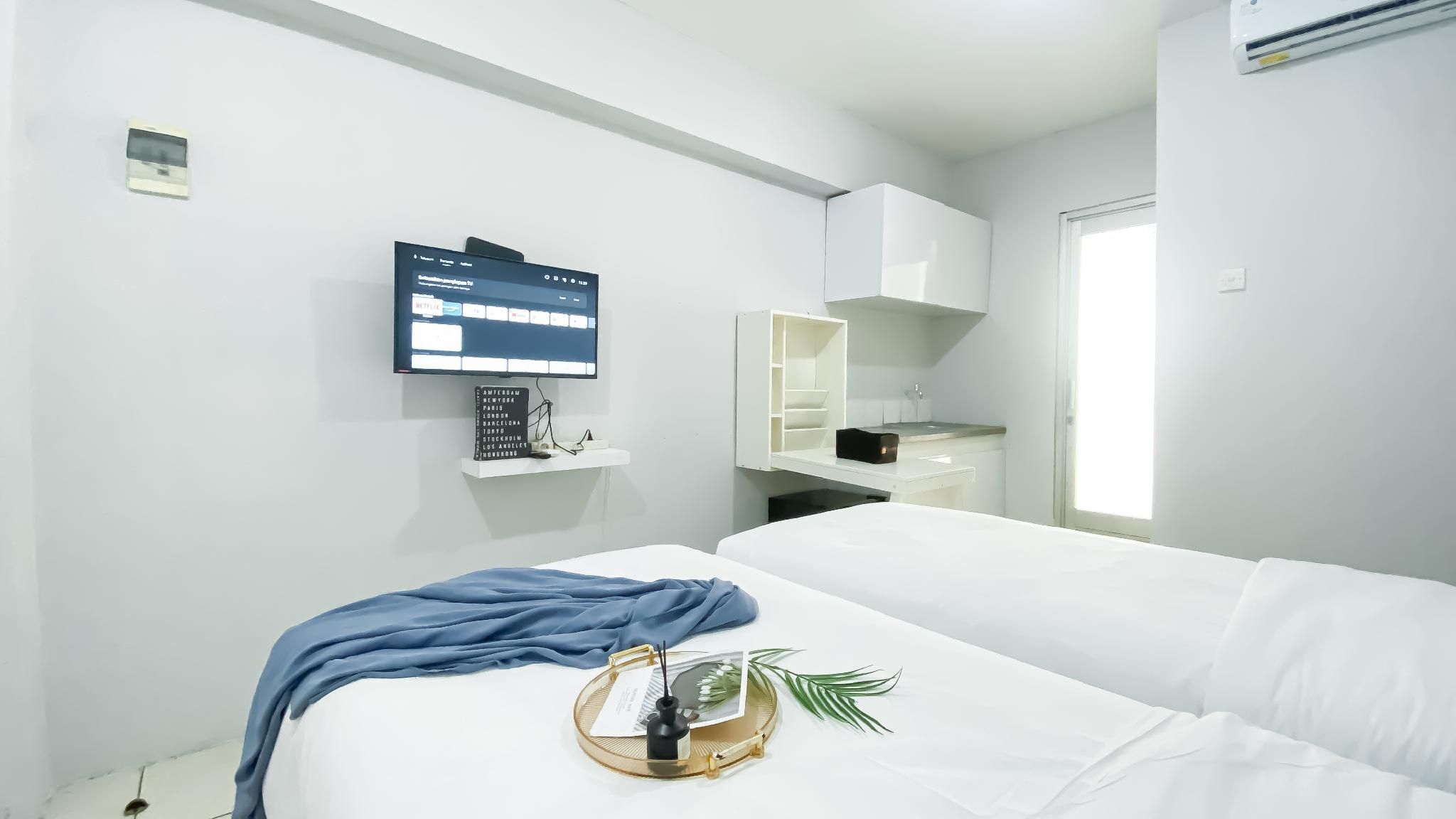 Homey Grey Studio at Grand Asia Afrika By Travelio