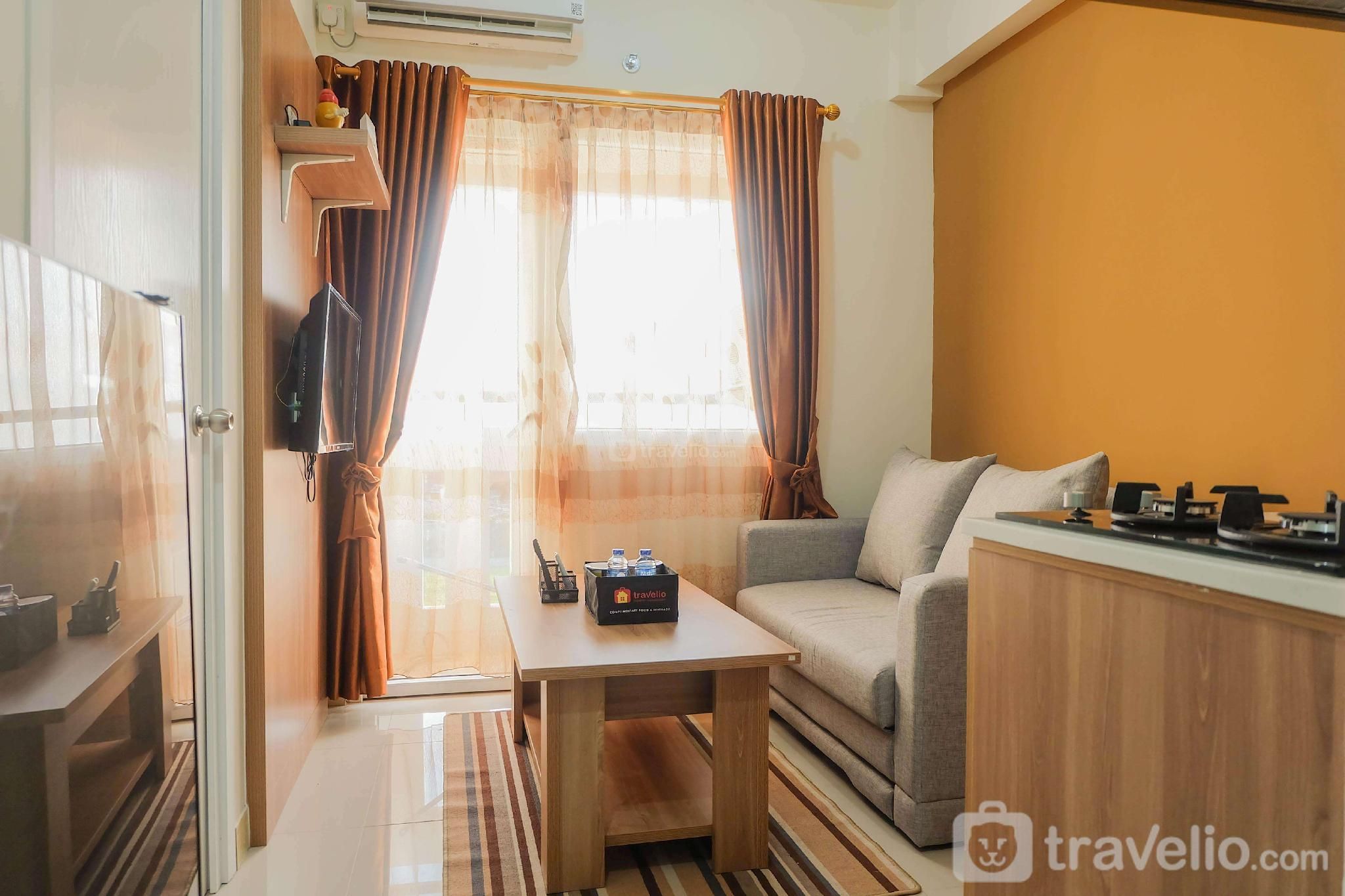 Fully Furnished 2BR Green Pramuka Apt By Travelio