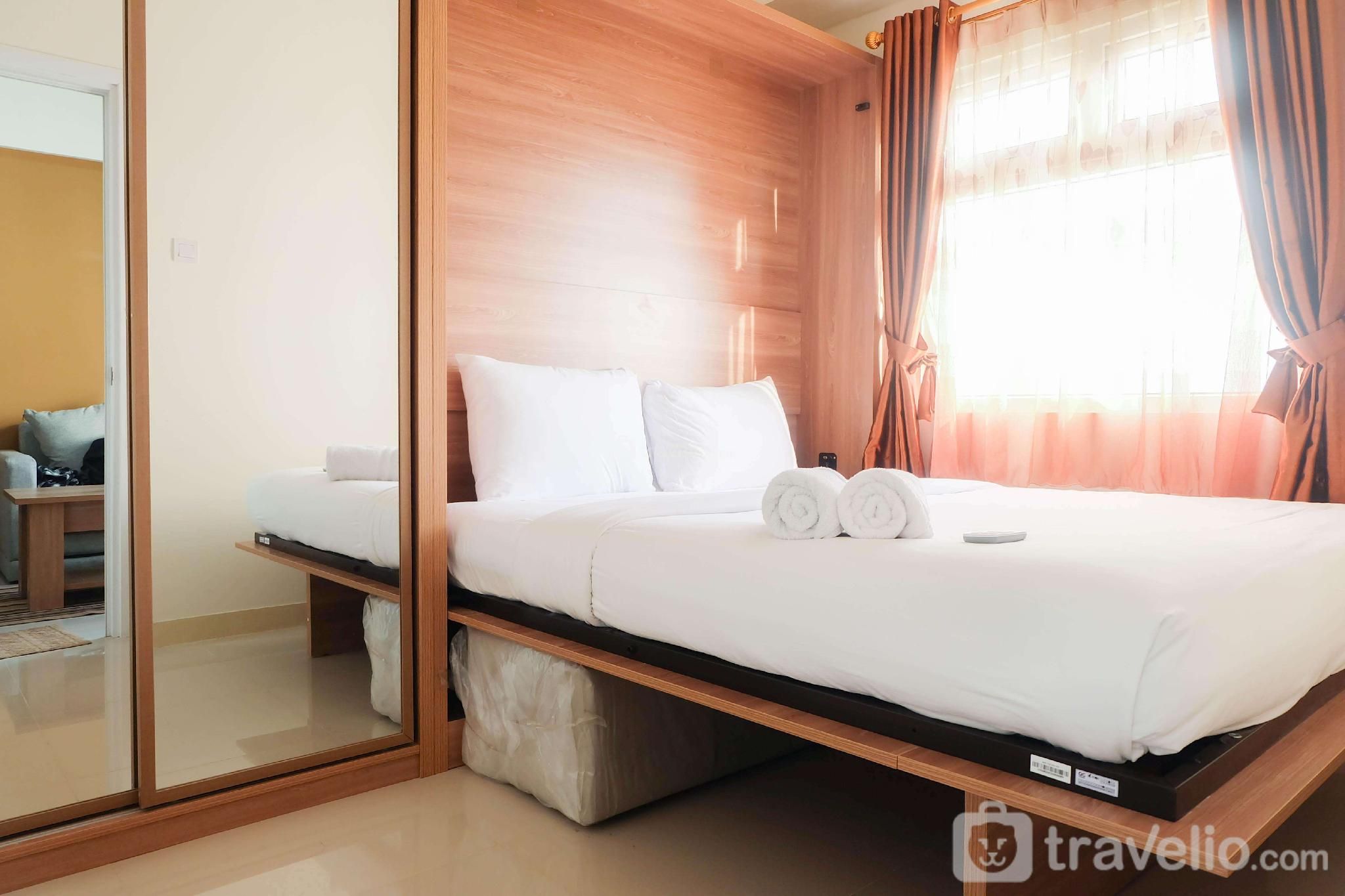Fully Furnished 2BR Green Pramuka Apt By Travelio