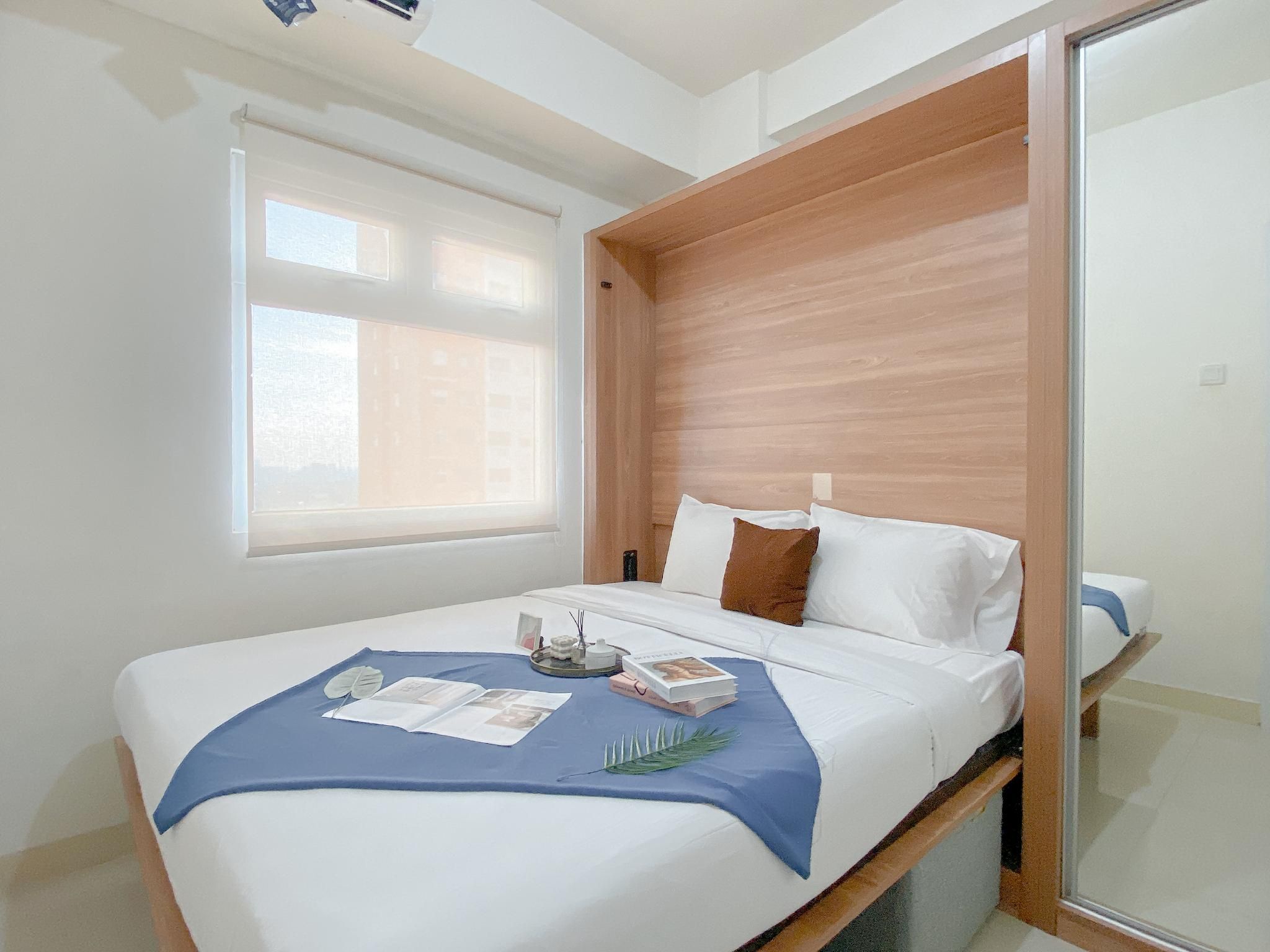 Compact 2BR Apt at Green Pramuka City By Travelio