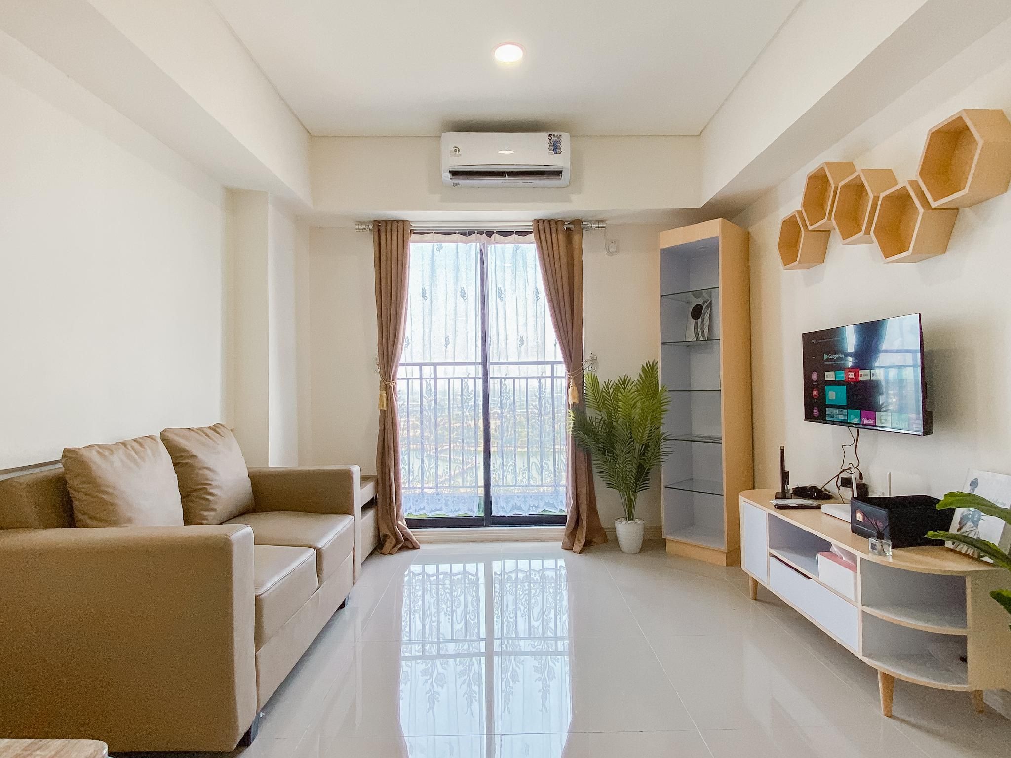 Convenient Tidy 2BR Meikarta Apartment By Travelio