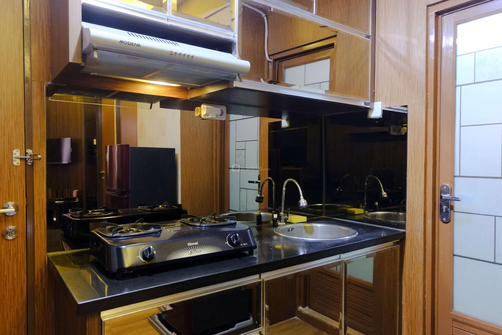 Strategic 2BR Tamansari Panoramic Apt By Travelio