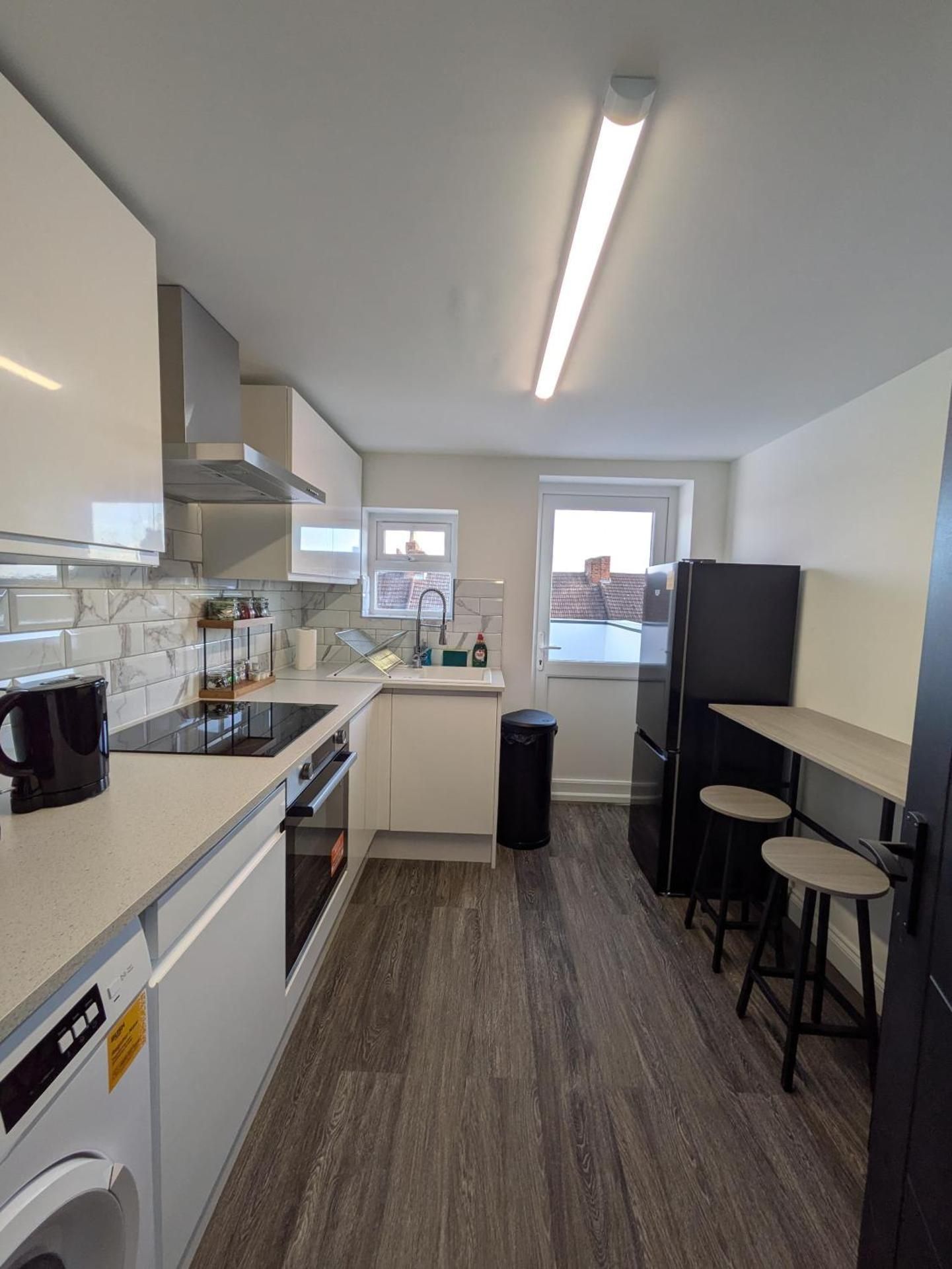 Four-Bedroom Apartment with Balcony 